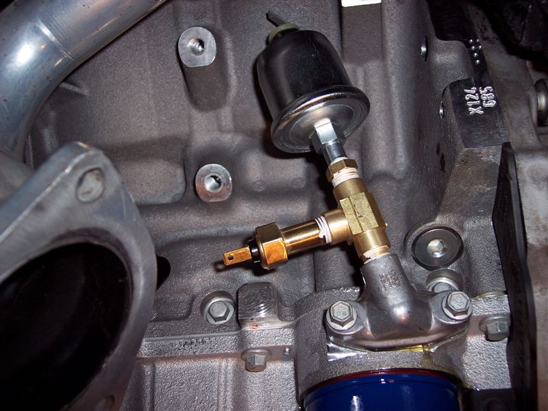 Here the 85's oil pressure and temperature sending units are installed with a 1/4" brass tee.
