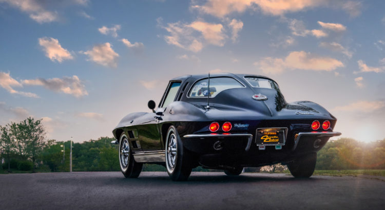 A black 1963 Chevy Corvette from behind.